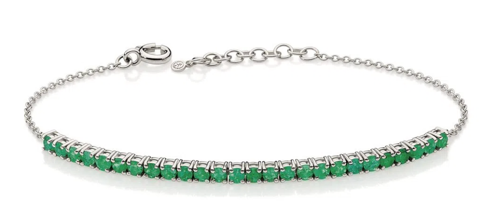 Pulseira Riviera de esmeraldas em ouro branco, design elegante e sofisticado.