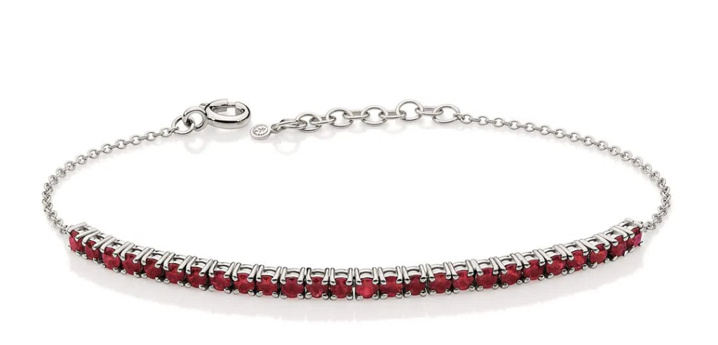 Pulseira Riviera de rubis em ouro branco, joia sofisticada e vibrante.
