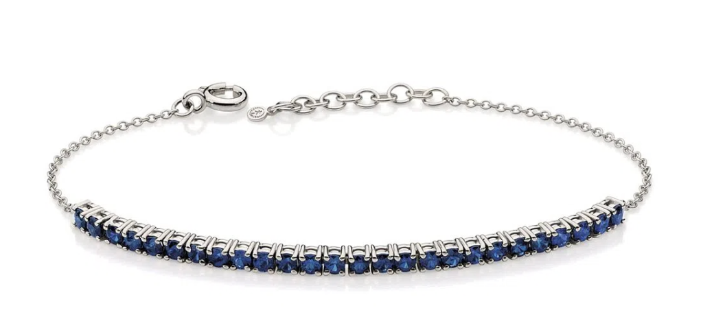 Pulseira Riviera de safira em ouro branco, design clássico e sofisticado.